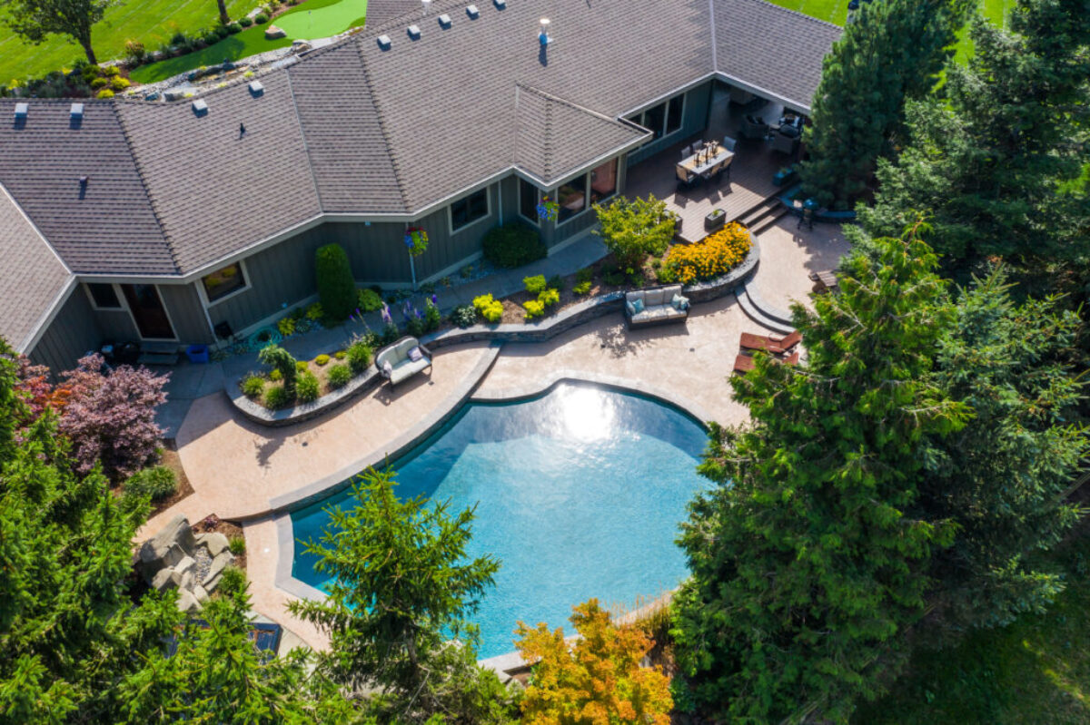 Aerial view of a complete landscape with pool, terraces, and planting